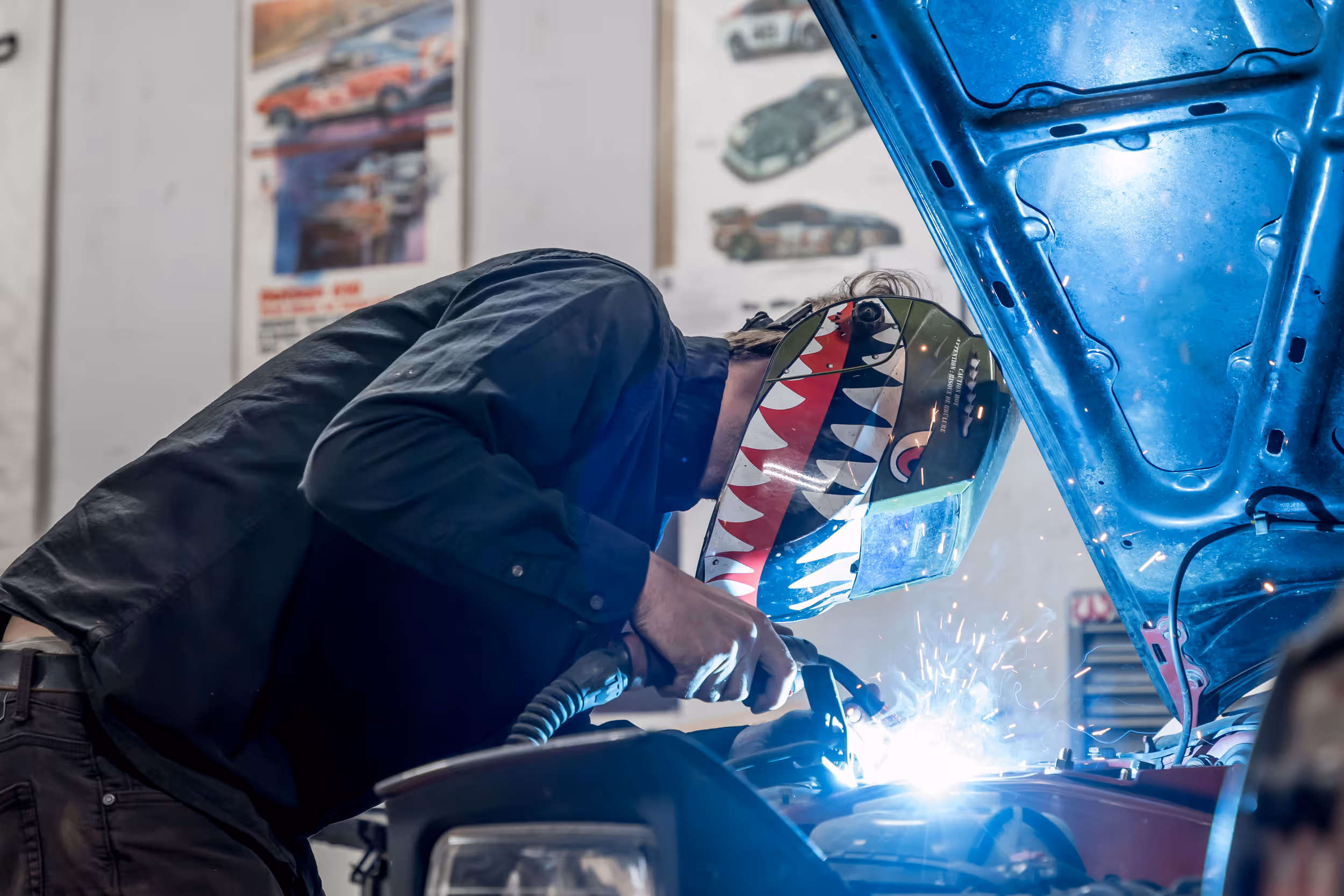 Dan performing a precise TIG weld during an automotive repair at DTM Fabrication.